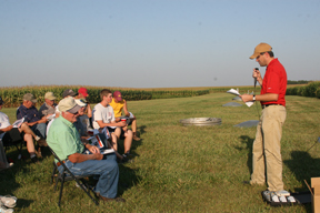 helmers talking to people in chairs